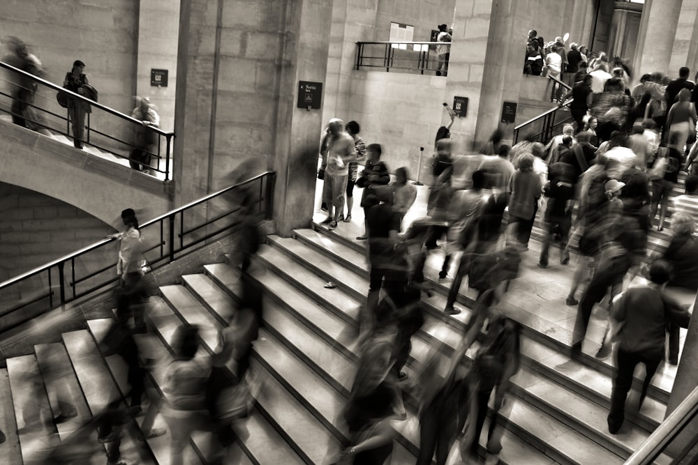 group of people walking on the stairs