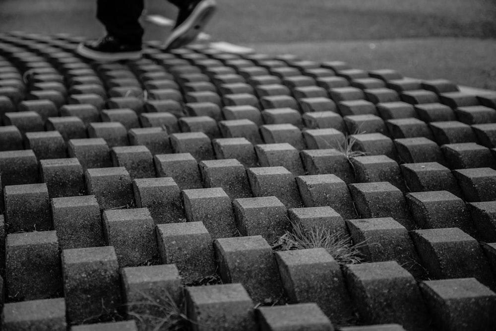 person standing on concrete block