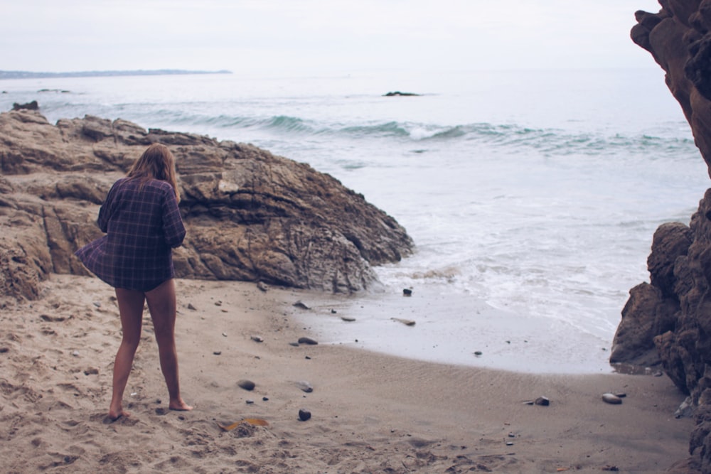 Woman on vacation steps out of the cove to relax in the beach shores