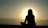 A serene setting with a person meditating outdoors during sunrise, symbolizing spiritual peace and healing.