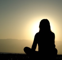 woman sitting on sand