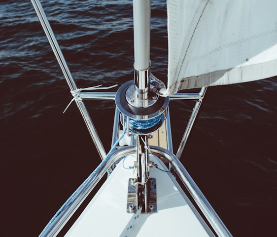 silver and white boat on body of water