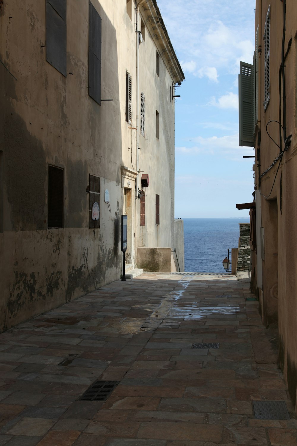 empty street near body of water