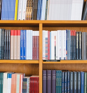 A bookshelf filled with law books in the office.