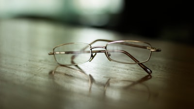 eyeglasses on table spectacle zoom background