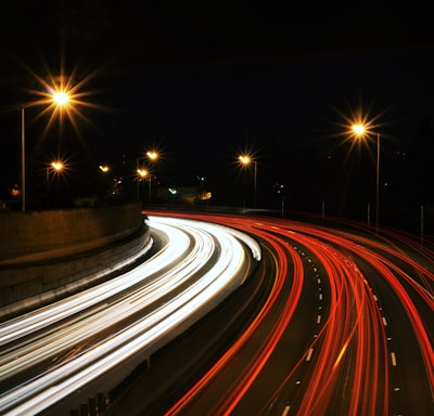 time-lapse photography of highway road at night