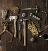 Neatly arranged woodworking tools including chisels and a hammer.