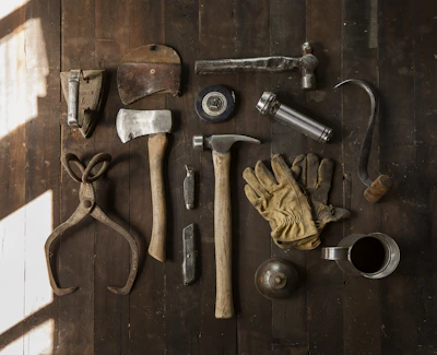 Neatly arranged woodworking tools including chisels and a hammer.