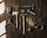 Close-up of vintage tools arranged neatly on a wooden workbench.