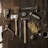 clothes iron, hammer, axe, flashlight and pitcher on brown wooden table