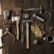 clothes iron, hammer, axe, flashlight and pitcher on brown wooden table