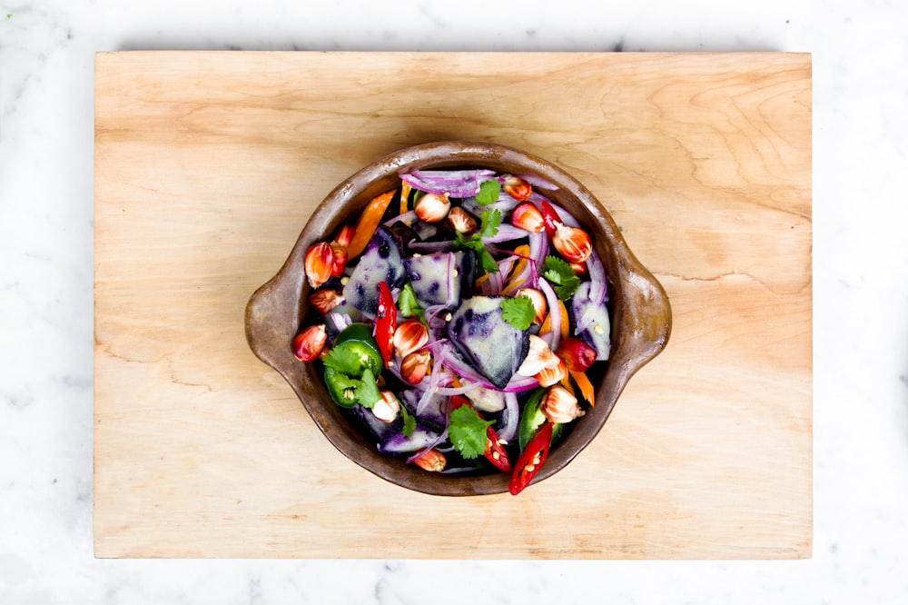 sliced onions and bell pepper in a bowl