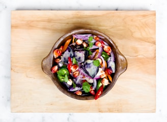 sliced onions and bell pepper in a bowl