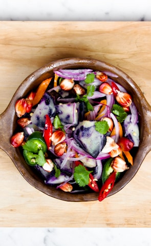 sliced onions and bell pepper in a bowl