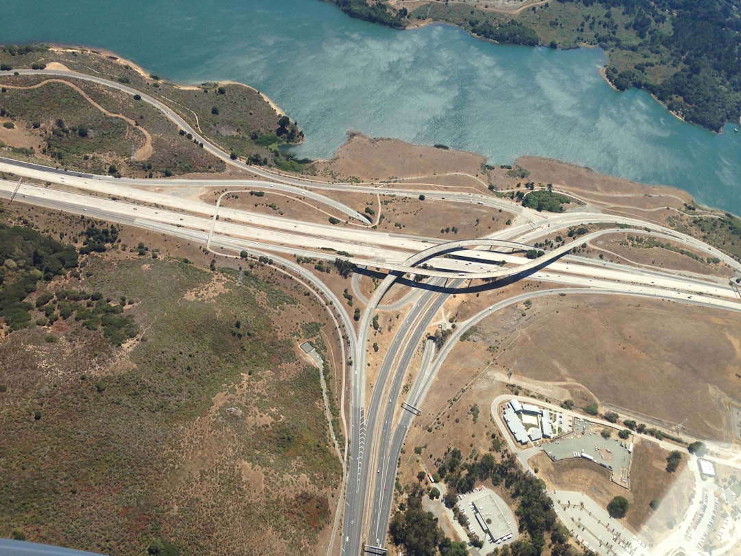 aerial photography of highway, Interchange by a river