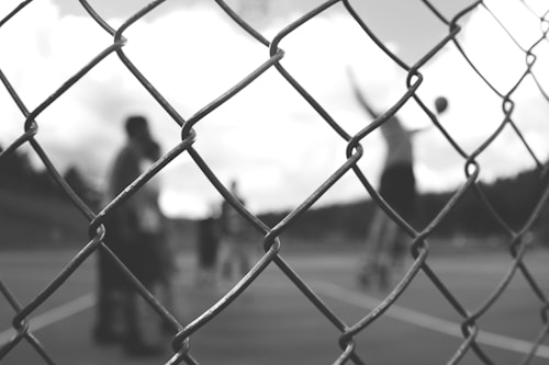 fence,metal,game,basketball,spectator,athletic,court,black and white,bokeh,blur,monochrome,chain link fence,person,black & white,kid,team,urban,chainlink fence,rabitz,black&white