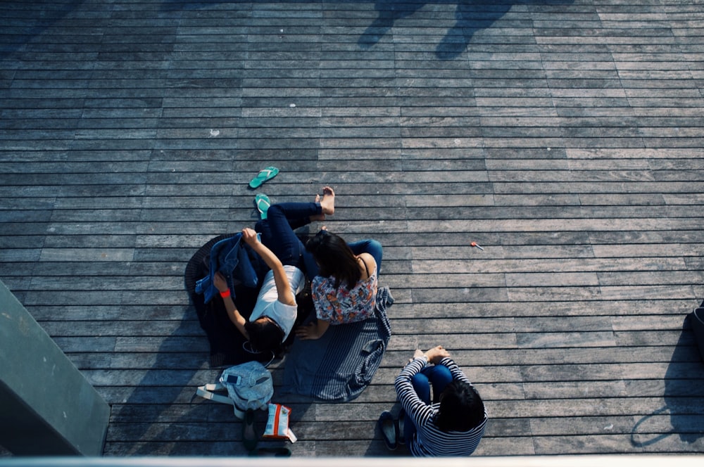 person laying on wooden flooring