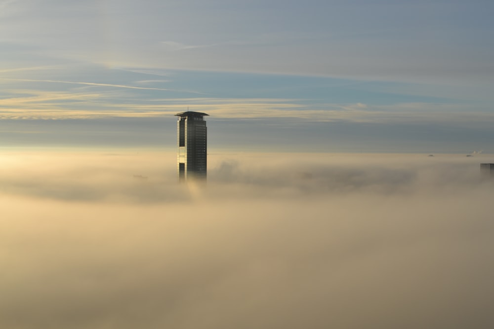 aerial view of skyscraper piercing clouds