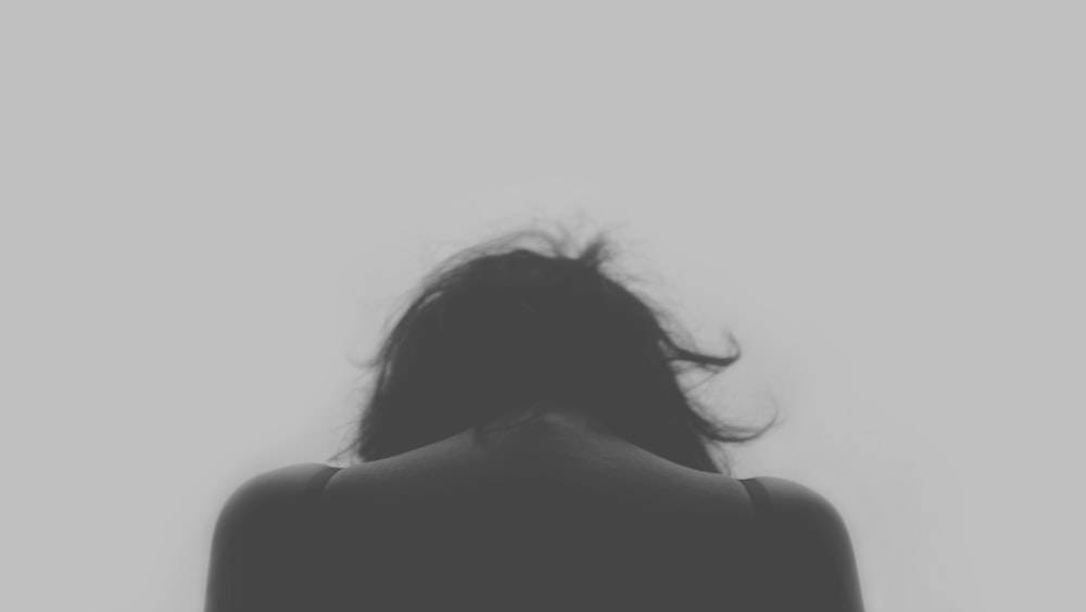 grayscale photo of person's back