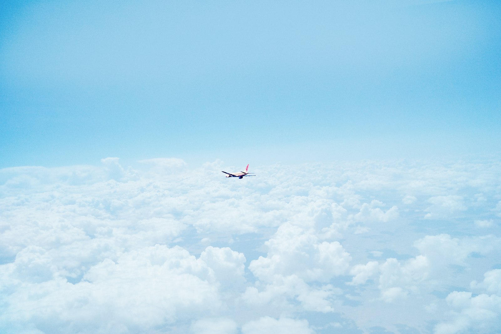Fujifilm X-T1 + Fujifilm XC 50-230mm F4.5-6.7 OIS sample photo. Flying airplane above clouds photography