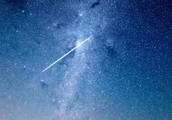 shooting star under blue sky