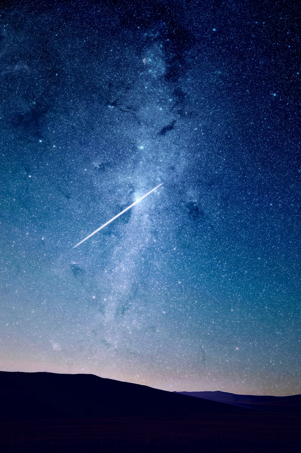 shooting star under blue sky