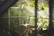 A serene therapy room with soft natural light and calming green plants.