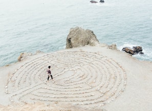 person walking on beach during daytime