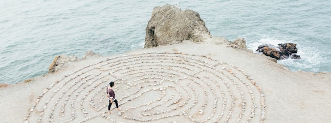 person walking on beach during daytime