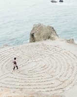 person walking on beach during daytime