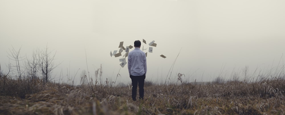 man standing on grass