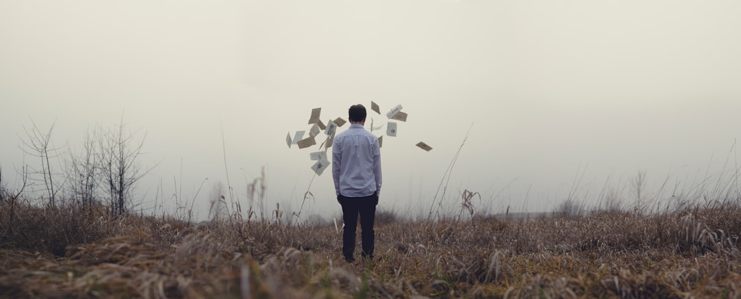 man standing on grass