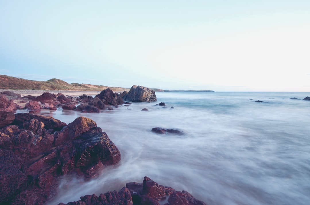 landscape photography of body of water near shore