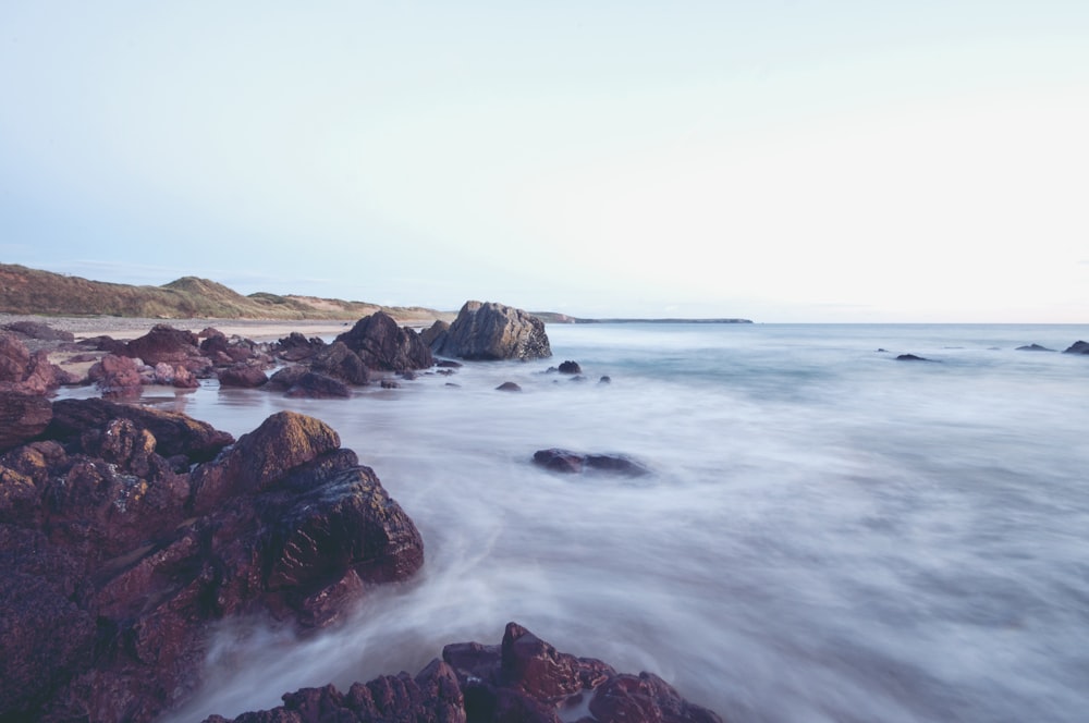 landscape photography of body of water near shore