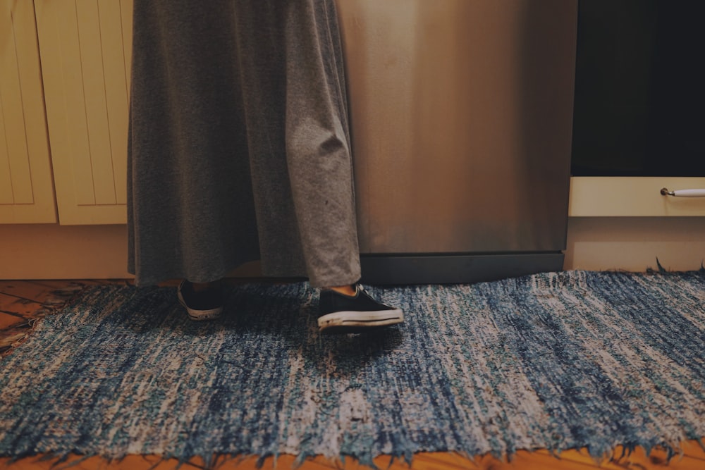 person standing at kitchen