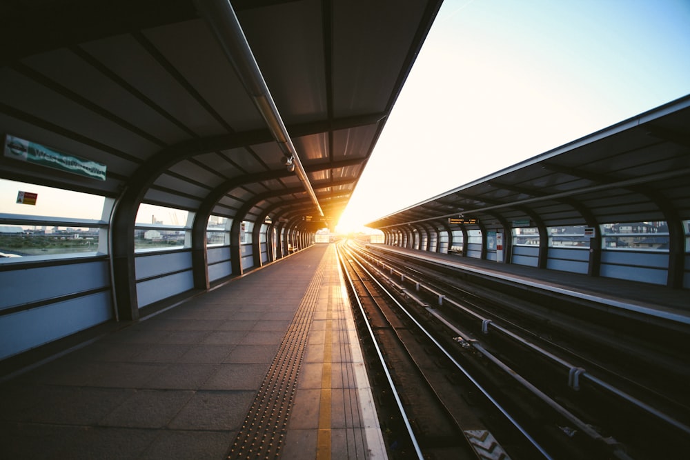 A group of people standing next to a train station photo – Free Italia  Image on Unsplash