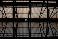 Close-up of a flexible PVC membrane being installed on a ceiling frame.