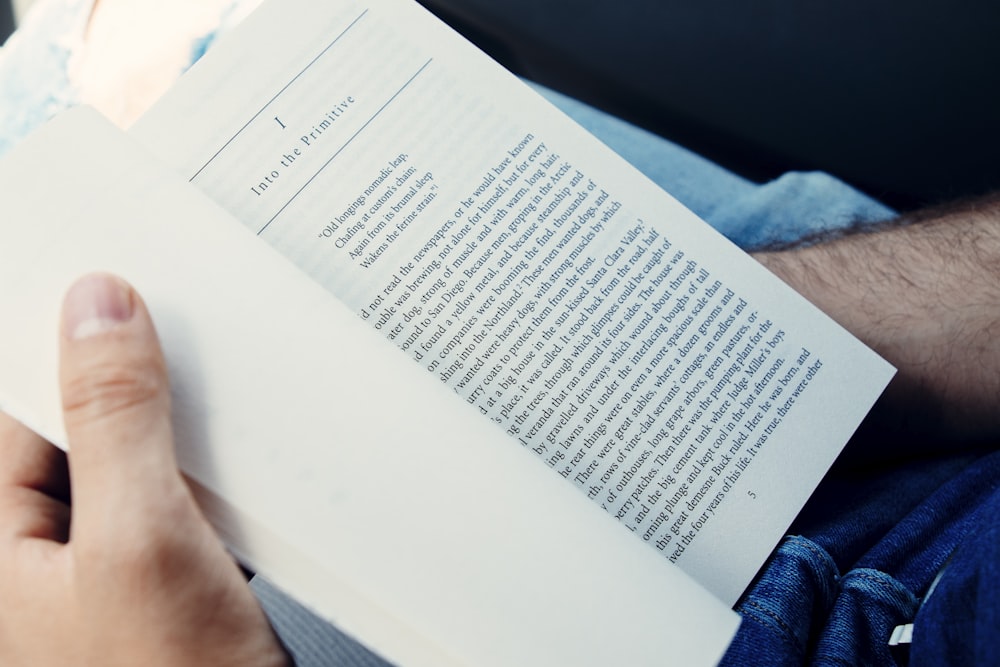 person holding I Into The Primitive book