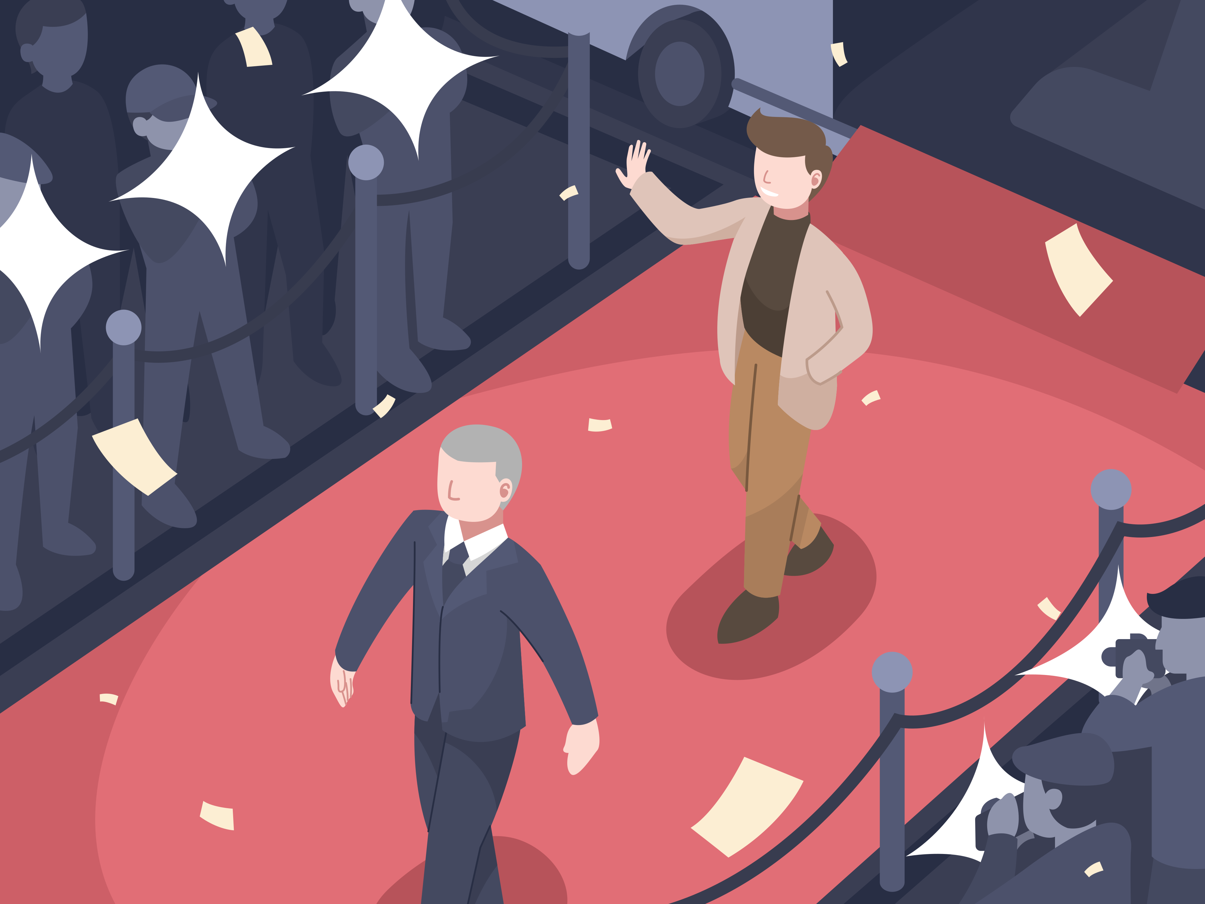 A man standing on a red carpet in front of a crowd of people