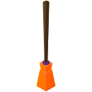 An orange object with a wooden stick sticking out of it