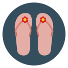 A pair of flip flops with a flower in the middle