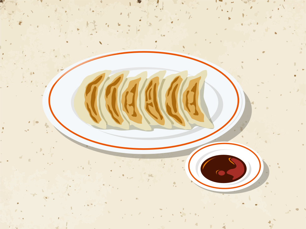 A plate of food on a table with a bowl of sauce