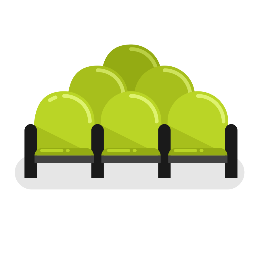 Se muestra una fila de asientos verdes de cine.