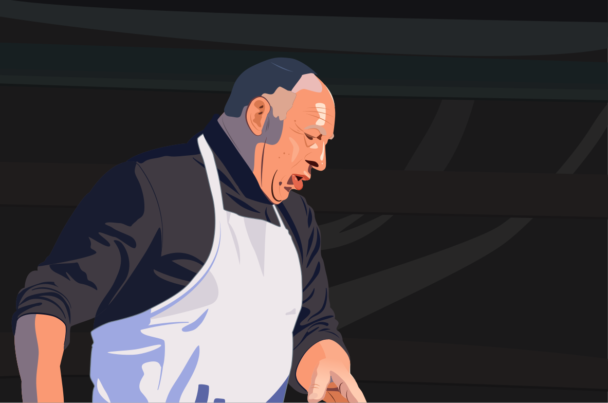 The chef is working diligently in the kitchen.