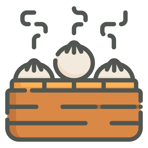 Steaming soup dumplings in a bamboo steamer.