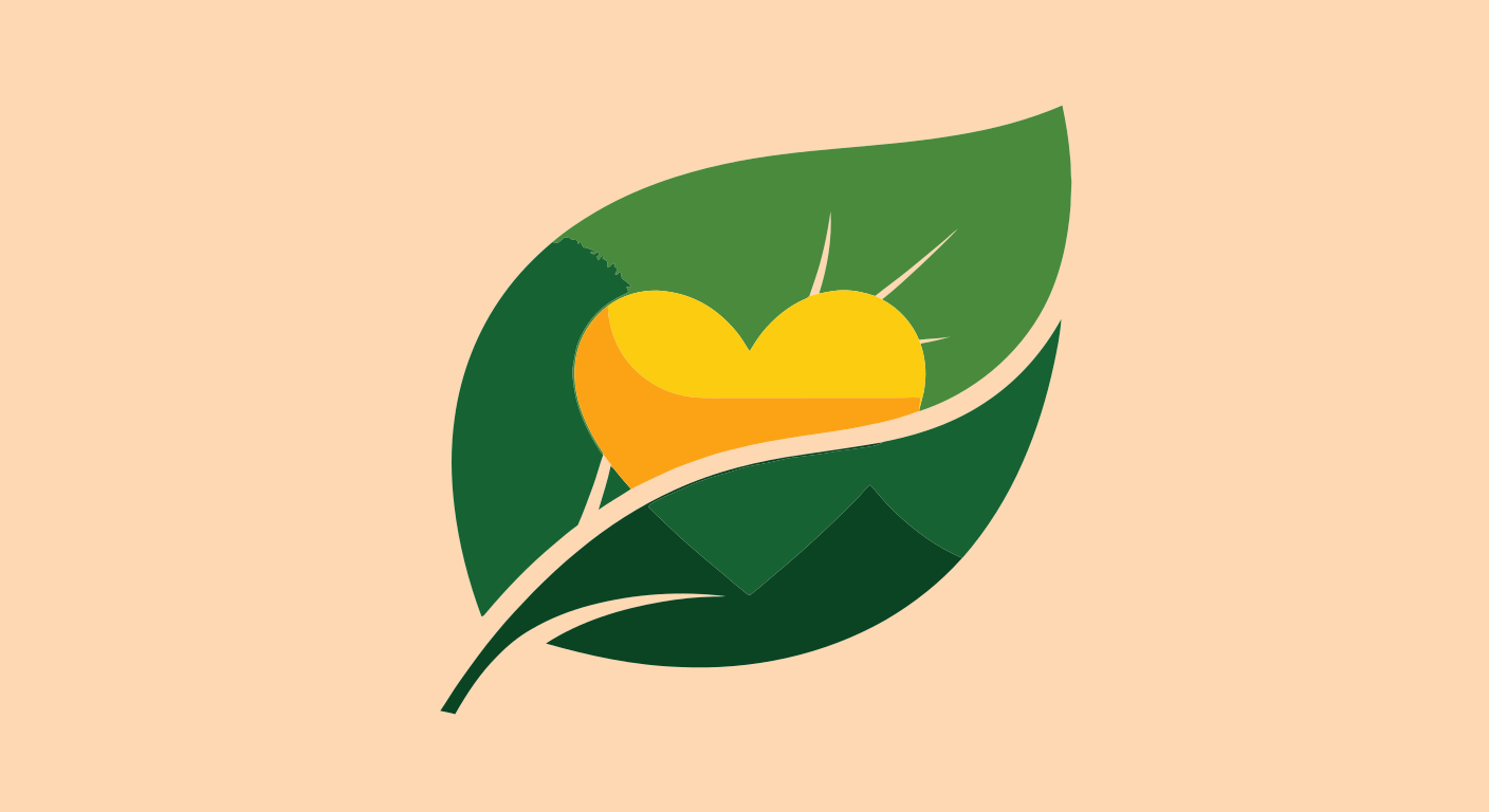Green leaf with a golden heart and sun