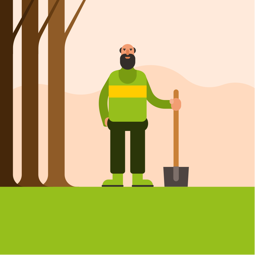 Man with shovel standing in a grassy area.