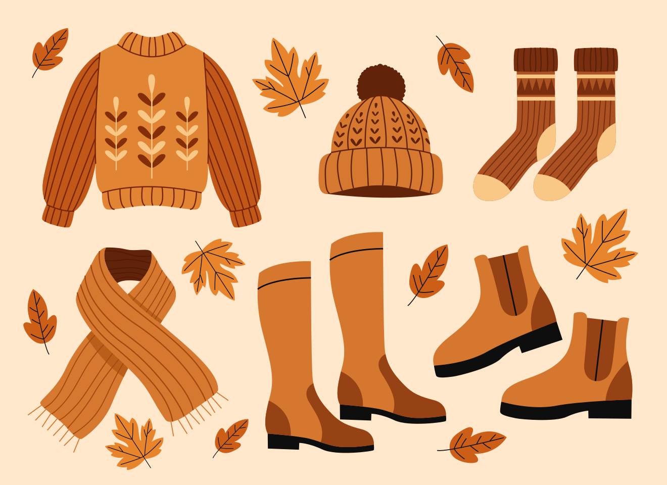 Autumn clothing and leaves arranged on a light background