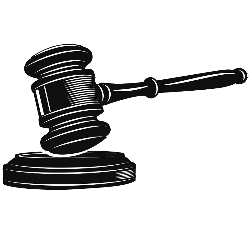 Um martelo de madeira repousa sobre seu bloco