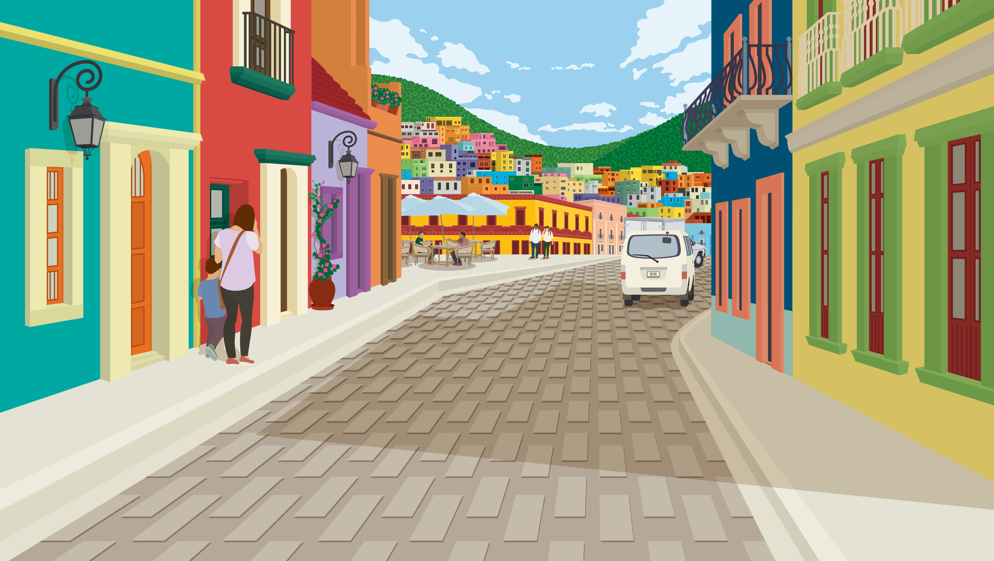 Colorful buildings line a cobblestone street in a town.